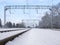 Railway tracks among the white winter snowdrifts  rural railway