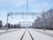 Railway tracks among the white winter snowdrifts  rural railway