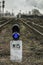 Railway traffic light with a blue standard signal. Semaphore on railroad crossing on a blurred background. Infrastructure Old