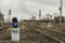 Railway traffic light with a blue standard signal. Semaphore on railroad crossing on a blurred background. Infrastructure Old