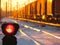 Railway traffic light shows blue signal on railway and railway with freight train as the background