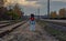 Railway traffic lights between rail tracks, showing a red stop signal