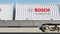 Railway transportation of containers with Robert Bosch GmbH logo. Editorial 3D rendering