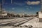 Railway view background. Sunny day, bright sky. Red train arrival