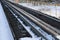 Railway in winter. Rails and sleepers - a road for locomotives and electric locomotive covered with snow.