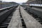 Railway in winter. Rails and sleepers - a road for locomotives and electric locomotive covered with snow.