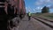 Railway worker climb up on wagon