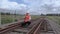 Railway worker on walkie talkie on the railway bridge