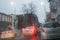 Rain on the city street through a car windshield. Rain drops on window, rainy weather