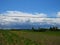 Rain cloud covers the blue sky