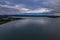 Rain clouds and aerial reverse sunset seascape at Corrigans Beach