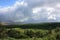 Rain clouds casting dark shadows over the rolling hills of North Kohala, Hawaii