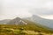 Rain clouds looming in the Carpathians before the rain and hail. On the slopes of snow