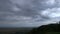 Rain comes over the plains and hills - time lapse