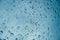 Rain drop wet moise on the glass blue cool fresh chill nature background