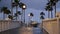 Rain drops, evening in Oceanside California USA. Pier, palms in twilight dusk. Reflection of light.