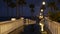 Rain drops, evening in Oceanside California USA. Pier, palms in twilight dusk. Reflection of light.