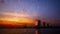 Rain drops on glass over the river city. Blurred City and river under the Rain during sunset, with raindrop on the glass window.