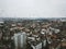 Rain drops running down the glass window overlooking the whole city Cologne in Germany. Cityscape view from the top viewpoint in