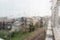 Rain drops on window glasses surface with city background. Natural Pattern of raindrops isolated on urban background