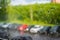 Rain drops on the window. A row of blurry cars outside the window. Summer rain on a sunny day.