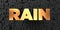 Rain - Gold text on black background - 3D rendered royalty free stock picture