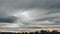 Rain and gray clouds. Puffy fluffy dark clouds. Cumulus cloud sky cloudscape time lapse. Autumn time lapse. Nature