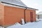 Rain gutter system in winter with ice and snow damage.