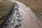 after the rain the parked road is from mud