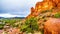 Rain pouring down on the geological formations of the red sandstone buttes surrounding the Chapel of the Holy Cross at Sedona