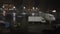 Rain runs down an airport terminal window as a white jet sits on the tarmac in the distance