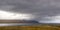 Rain shower over fjord, east cost Iceland