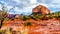 After rain showers, streams and puddles forming at Courthouse Butte, a famous red rock between the Village of Oak Creek and Sedona