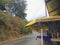 Rain soaked Himalayan retail shop serving eggs and cold drinks, village at Devprayag, Uttarakhand, India. Himalayan mountains in