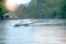 Rain on Stump in the river and houseboat at kwai river landscape