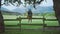 Rain, umbrella and girl on fence in countryside enjoying weather, scenic view and mountain landscape. Wellness, calm and