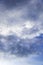 Rain / Water drop of rain on glass with blue sky and cloudy outdoor background