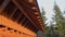 Rain water dropping from roof, wooden house