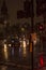 The rain and wet roads in london in night with street lights and vehicles