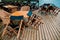 The rain wets the tables and chairs of a restaurant without customers in an Italian lake for tourists