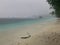 Rain at Yenanas beach, Kabui Bay, Gam island, Raja Ampat - West Papua, Indonesia