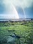 Rainbow above the famous Dinosaur footprints at An Corran beach by Staffin on the isle of Skye