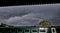 Rainbow above a Train with Dark Sky