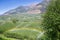 Rainbow above Watering with Sprinklers of Apple Tree Plantation, Italy