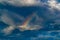 Rainbow against a bright blue sky and white fluffy clouds  - Blurred photo bokeh