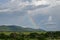 Rainbow against a mountain background, Taita Hills, Kenya