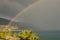 Rainbow appeared after heavy rain. Beautiful landscape photo. Marina di Patti. Sicily