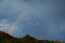 Rainbow appearing behind nature after the storm