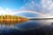 rainbow arcing over a serene lake