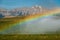 Rainbow around the farmers water sprayer machine, Alberta, Canada